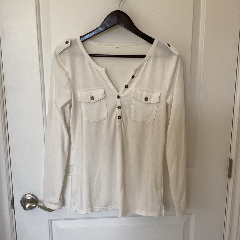 White Henley long sleeve shirt.